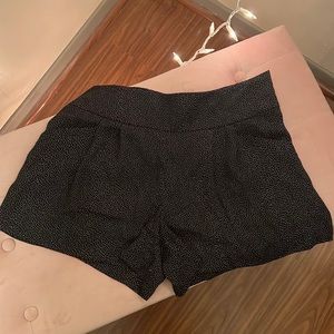 Black shirts with small white dots